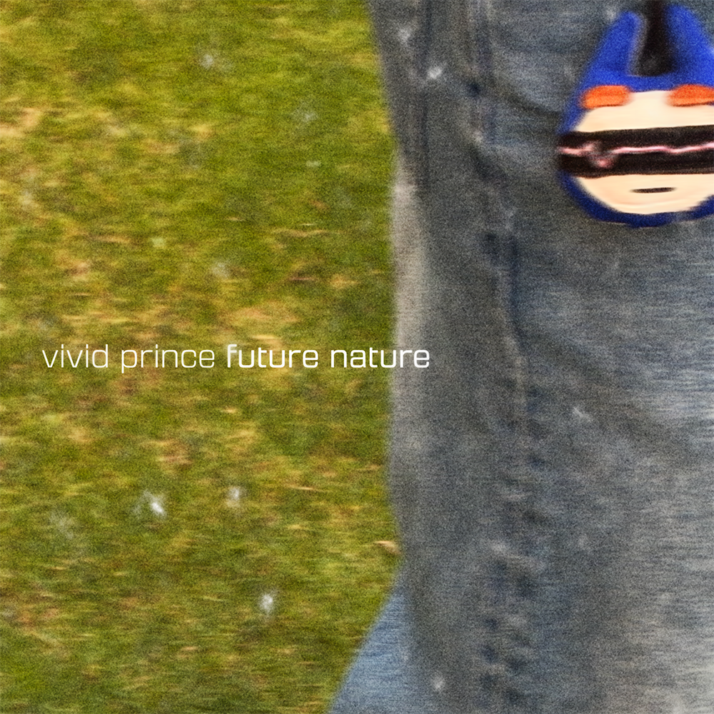 Black and white sneakers and a handmade blue keychain on grass